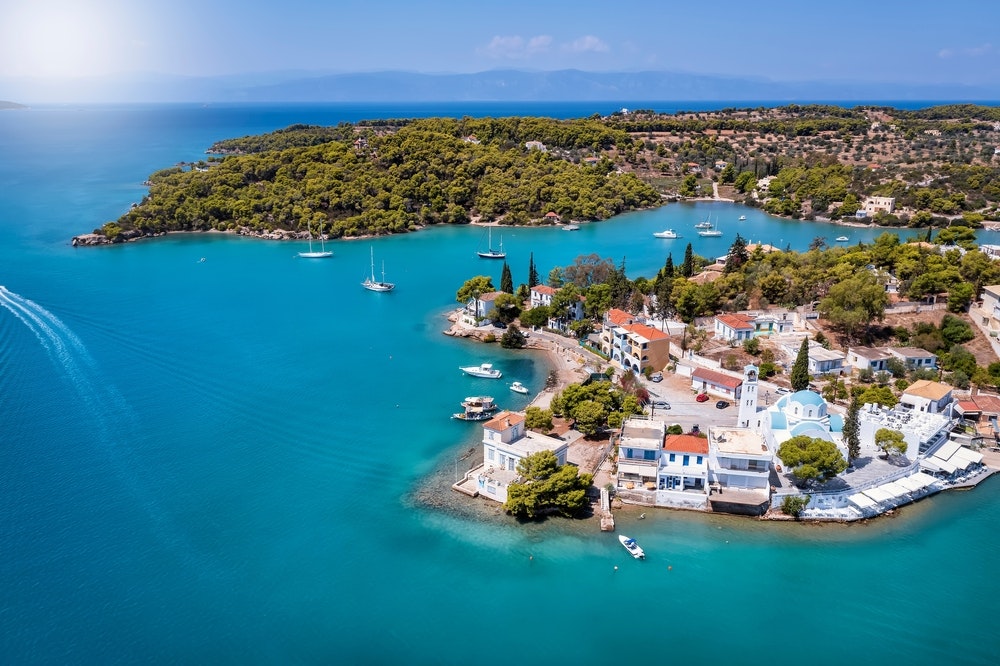 An elevated perspective of the city Porto Cheli, an upscale coastal getaway located on the eastern border of the Peloponnese peninsula in Greece.