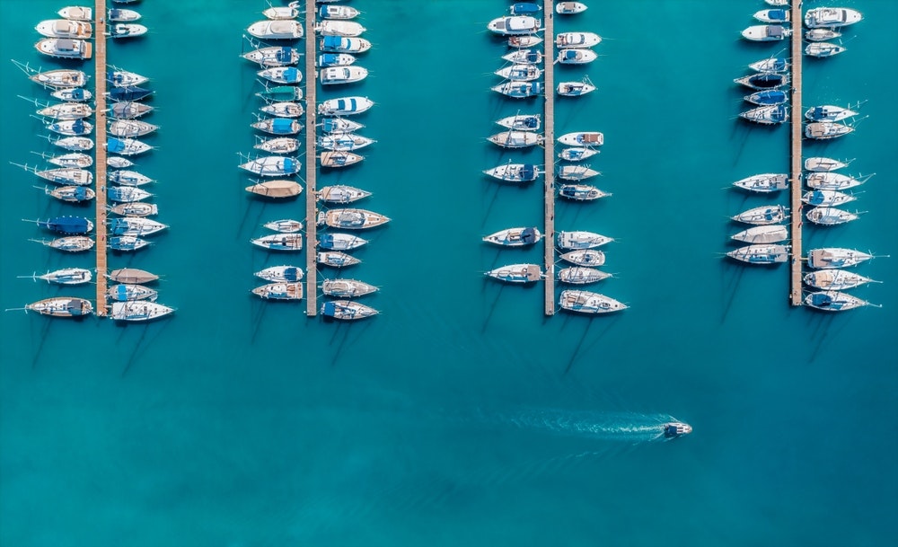 An aerial view of luxury yachts and speedboats moored in the harbour. Pula, Croatia