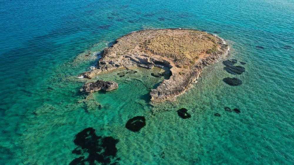 Prehistoric settlement of Pavlopetri, an archaeological site just under the water near the popular beach of Pounta and the island of Elafonisos, Peloponnese, Greece