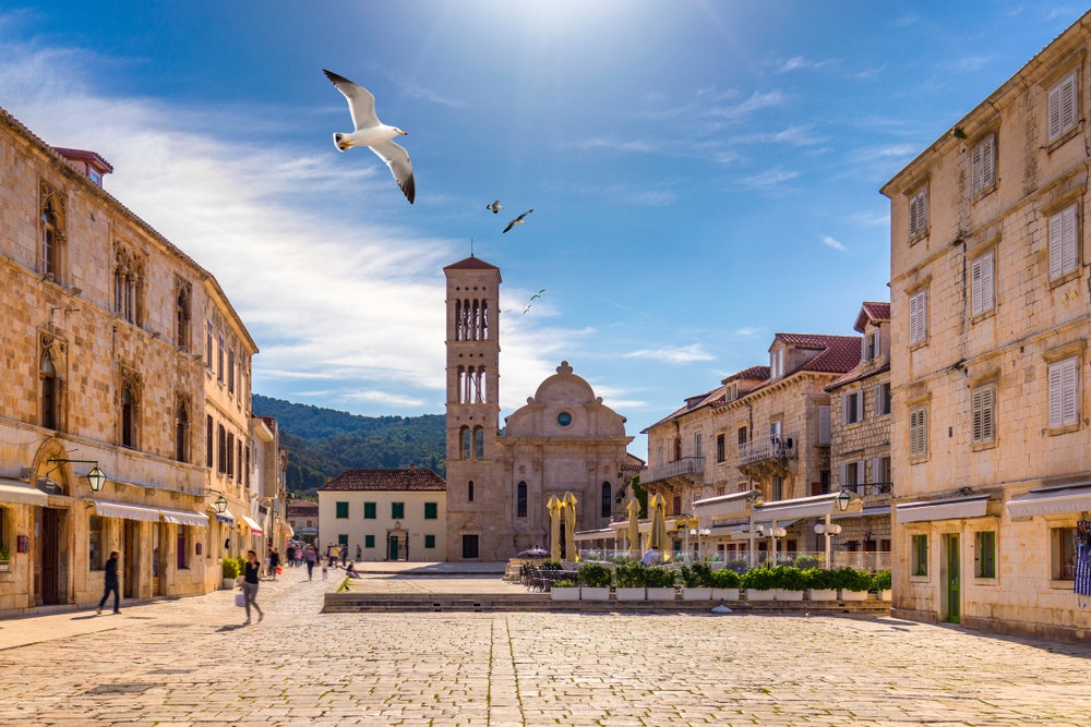 The main square in the old medieval town of Hvar with a seagull flyover.
