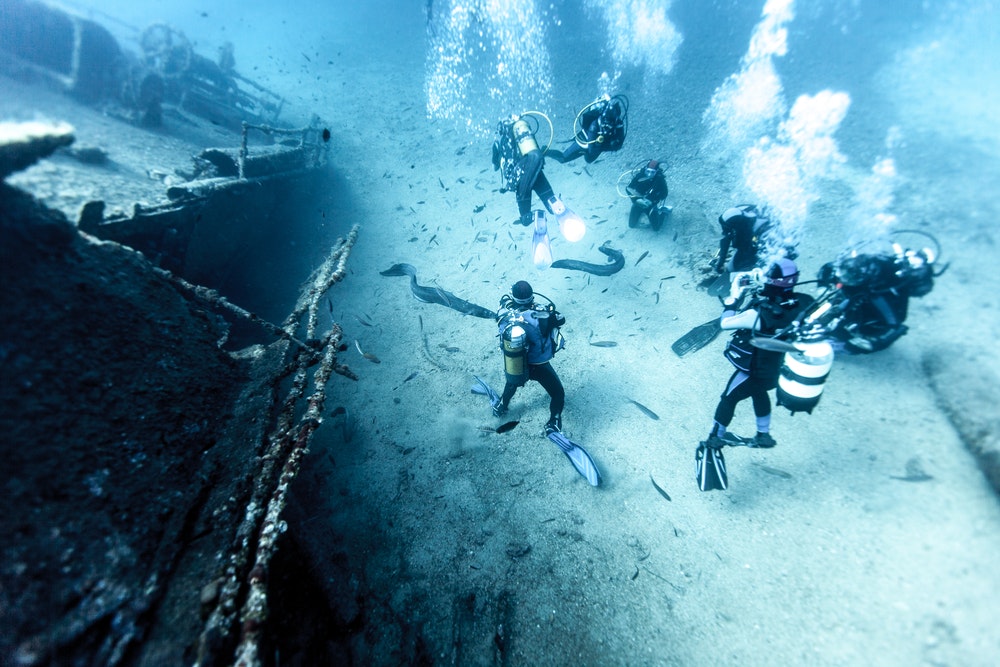 Divers at a shipwreck. 
