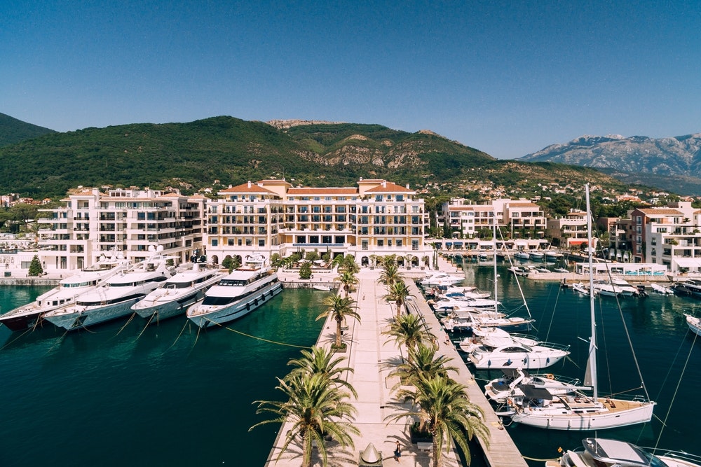 The pier leads to a luxurious and expensive hotel in Porto, Montenegro.