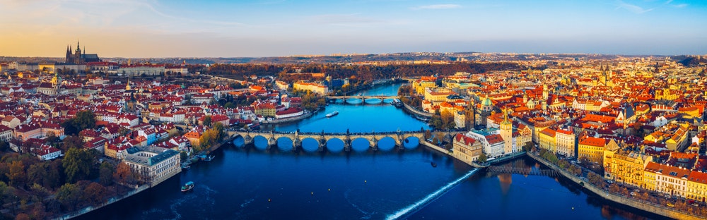 Vltava river flowing through Prague, view of bridges and the city