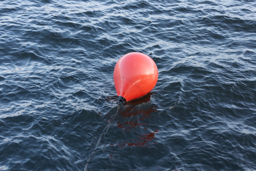 mooring buoys in red on the water