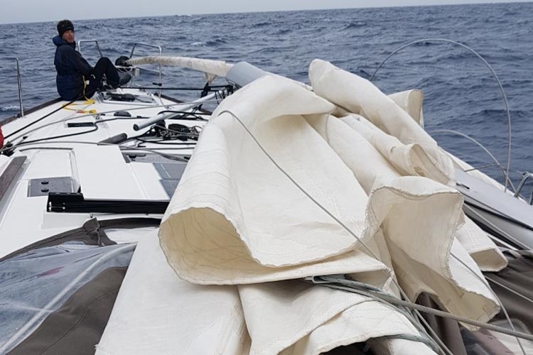 Lines and shrouds lying in the way around the mast