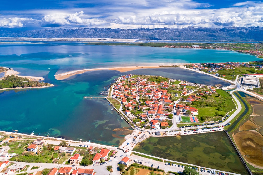 Historic town of Nin laguna aerial view with Velebit mountain background, Dalmatia region of Croatia